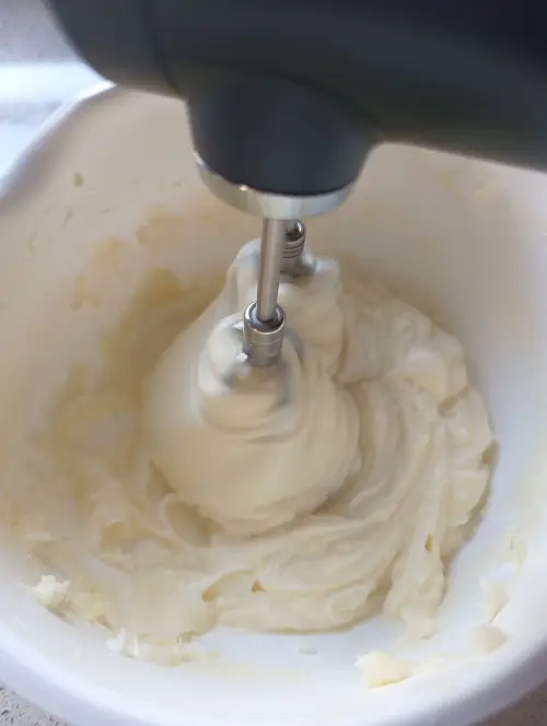 Beat the cream until smooth and creamy.